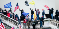 Rioters wave flags at the U.S. Capitol
