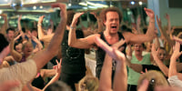 Fitness guru Richard Simmons works the crowd during one of his classes at Slimmons Studio on March 9, 2013 in Beverly Hills. 