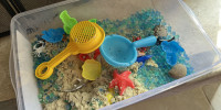 Child's sensory box toy with kinetic sand and water beads, Lafayette, California on Jan. 12, 2022.