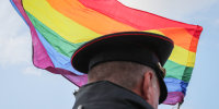 A law enforcement officer stands guard during the LGBT community rally in Saint Petersburg.