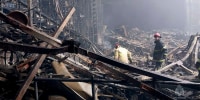 Firefighters work in the burned concert hall at the Crocus City Hall on the western edge of Moscow on March 23, 2024.