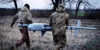 Ukrainian soldiers prepare a drone at the frontline near Bakhmut, in Ukraine's Donetsk region on March 26, 2024. 