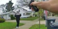 A police officer point his gun at a 15-year-old holding a fake gun on April 1, 2024, in Akron, Ohio.
