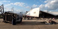 A strip mall is damaged by a tornado in Katy, Texas