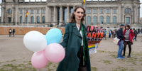 A demonstrator protests demanding a law to protect the rights of the transgender community outside of the parliament Bundestag building in Berlin