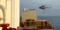 Image: This image made from a video provided to The Associated Press by a Mideast defense official shows a helicopter raid targeting a vessel near the Strait of Hormuz on Saturday.
