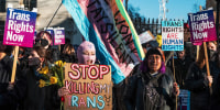 Trans rights activists attend a protest in London