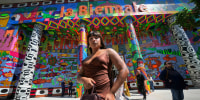 Brazilian artist Manauara Clandestina poses in front of the main pavilion at the Venice Biennale on April 16, 2024. 