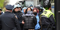 Police surround protesters supporting Gaza on the campus of Columbia University on April 18, 2024.