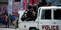 Police patrol Port-au-Prince.