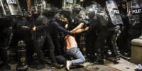 Clashes erupted between police and opposition demonstrators protesting a new bill intended to track foreign influence that the opposition denounced as Russia-inspired. 