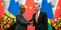 Jeremiah Manele, First Minister of the Solomon Islands, pictured with Chinese Foreign Minister Wang Yi in 2019.
