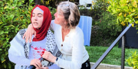Video recorded by a student shows a law professor Catherine Fisk attempting to grab the microphone out of a Palestinian student’s hand during an impromptu protest at her house.