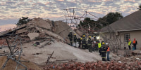 Rescue workers at the scene of a collapsed building in George, South Africa.