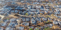An aerial view of burned homes
