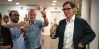 Socialist candidate Salvador Illa makes a toast with members of his team and party colleagues after the announcement of the results of elections to the Catalan parliament in Barcelona.