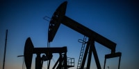 Oil pumpjacks at dusk in Willow Springs Park in Long Beach, Calif.