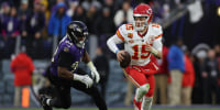 Patrick Mahomes runs with the football during a game between the Kansas City Chiefs and  Baltimore Ravens