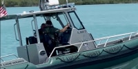 Marine unit assists coast guard in the water.