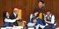 Lawmakers in Taipei exchanged blows during a vote over a Parliament reform bill on May 17, 2024. 