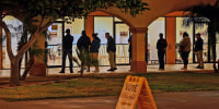 Voters wait in line on Nov. 8, 2022 in Guadalupe, Ariz.