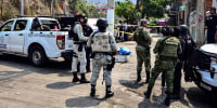 Security forces guard a crime scene where assailants left the dismembered body of a councilman candidate, in Acapulco