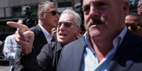 Robert De Niro, center, points his finger while arguing with a Donald Trump supporter near Manhattan Criminal Court.