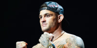 Dustin Poirier poses with two fists up