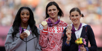 Natalya Antyukh, middle, holds the gold medal, Lashinda Demus, left, the silver medal and Zuzana Hejnova, the bronze medal during a ceremony for the women's 400-meter hurdles in the Olympic Stadium at the 2012 Summer Olympics, London