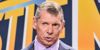 Vince McMahon speaks during a press conference