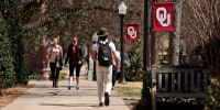 Students walk on campus between classes at the University of Oklahoma