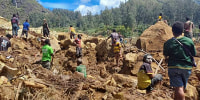 This handout photo taken and received on May 29, 2024 courtesy of Nickson Pakea, president of Porgera Chamber of Commerce and Industry, shows locals digging at the site of a landslide at Yambali village in the region of Maip Mulitaka, in Papua New Guinea's Enga Province. 