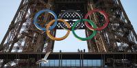 The Olympic rings are mounted on the Eiffel Tower on June 7, 2024 in Paris. 