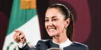 Claudia Sheinbaum points during a press conference