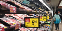 A woman browses the meat aisle at a supermarket in Montebello, Calif., on May 15, 2024. 