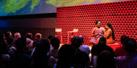 Janet Kilonzo, left, and Lebane Ayivor sit on stage during a play