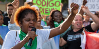Demonstrators protest in front of the Dominican Parliament in Santo Domingo, Dominican Republic
