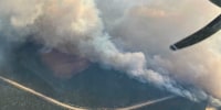 An aerial photo shows a wildfire.