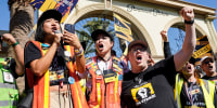 From left, Iris Liu, Miki Yamashita, and Duncan Crabtree-Ireland protest outside