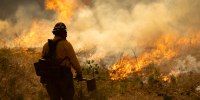 Firefighters set a backfire on the eastern front of the Park Fire