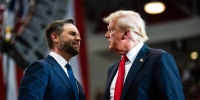 JD Vance, left, and Donald Trump shakes hands and look at each other