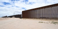 The U.S. - Mexico border wall in an empty landscape