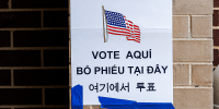 A "Vote Here" sign.