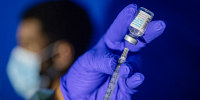 A family nurse practitioner prepares a syringe with the Mpox vaccine.