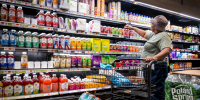 People shop at a grocery store