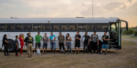 Migrants prepare to board a Border Patrol bus in Eagle Pass, Texas.