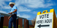 A voter walks to a voting precinct prior to casting his ballot in the state's primary election on July 30, 2024, in El Mirage, Ariz.