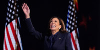 Kamala Harris waves as she arrives on stage