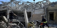 Ukrainian emergency services carry out a search and rescue operation among the rubble of a destroyed hotel after a strike in the town of Kramatorsk, Donetsk region.