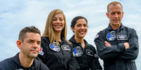 Polaris Dawn crew members Jared Isaacman, Anna Menon, Sarah Gillis, and Scott Poteet pose for a photo.